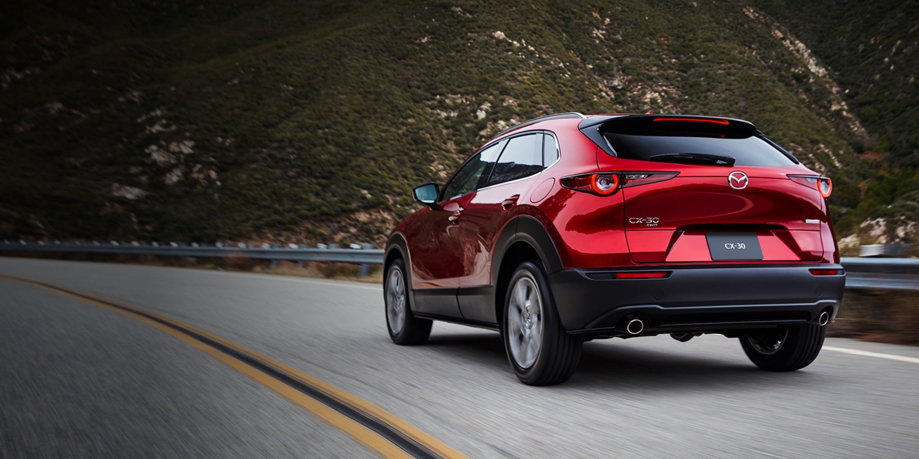Red 2020 Mazda CX-30 Driving on the road | Mazda of Milford in Milford, CT